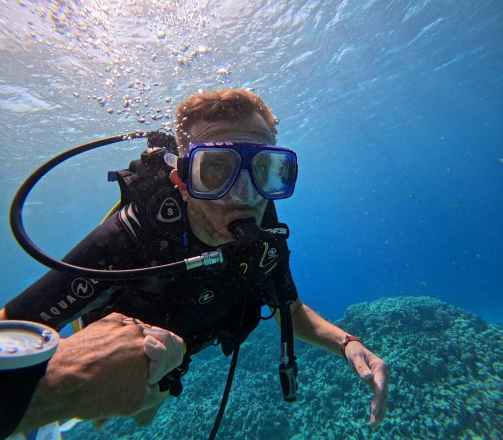 Diver checking their gauge